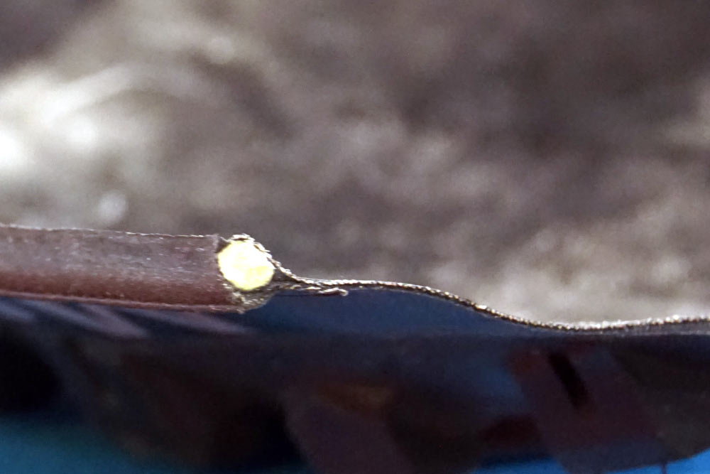 Terrene Tires Light casing cutaway to show minimal layers inside a mountain bike tire sidewall